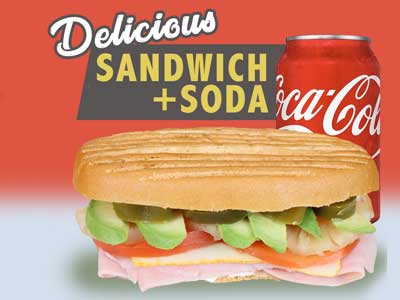 A delicious Ham Sandwich With A Can Of Soda.